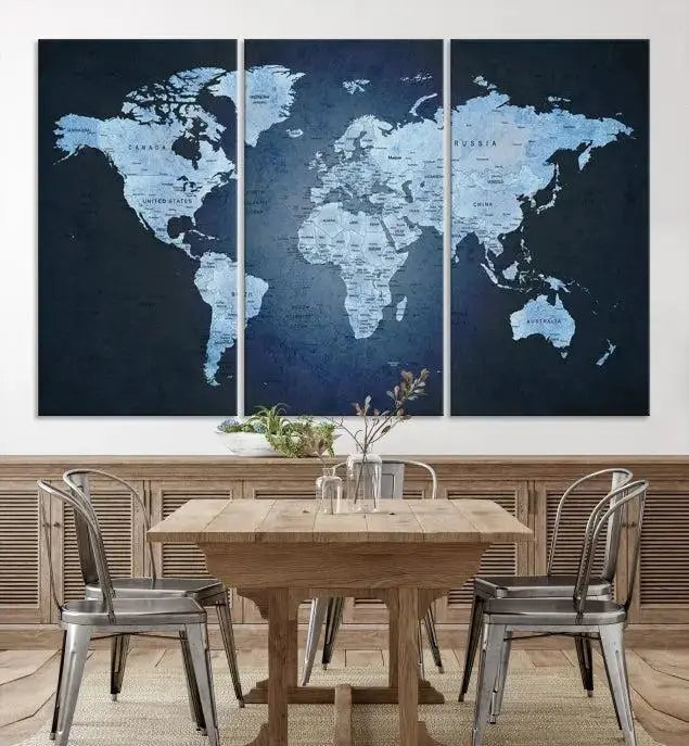 A modern living room featuring a World Map Wall Art Canvas Print in triptych format.