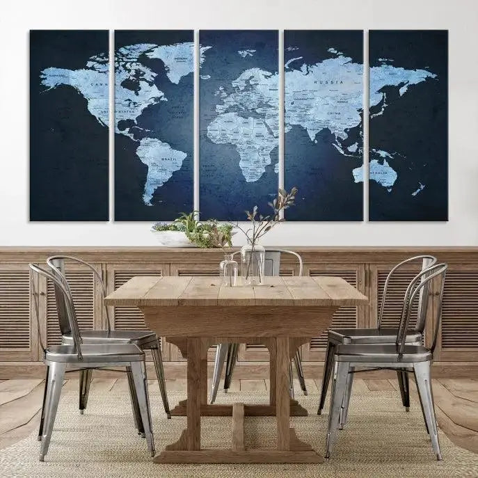 A modern living room featuring a World Map Wall Art Canvas Print in triptych format.