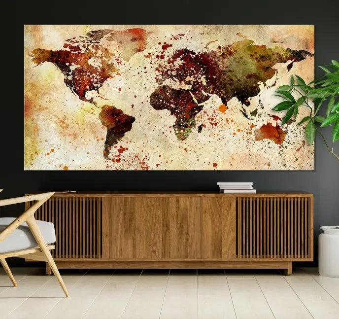 The World Map Wall Art Canvas Print, gallery-wrapped on museum-quality canvas adorned with watercolor splatters, enhances a modern living room decor. This artwork features a UV-protective coating to maintain its vibrant colors and elegant appearance over time.