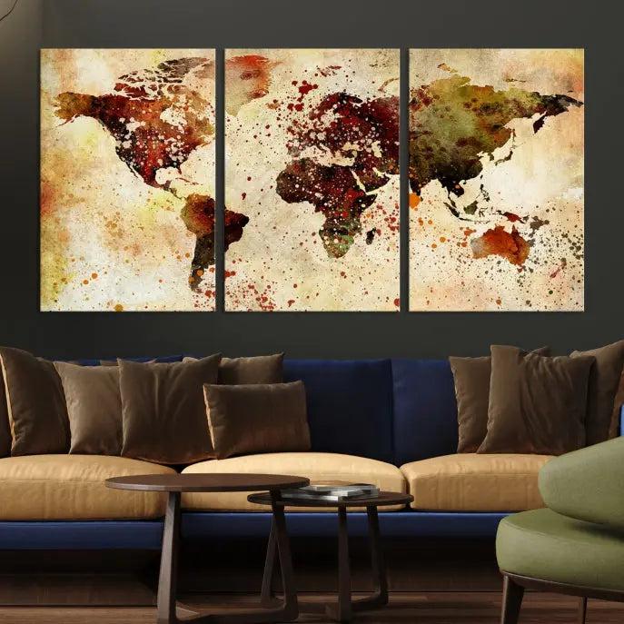 The World Map Wall Art Canvas Print, gallery-wrapped on museum-quality canvas adorned with watercolor splatters, enhances a modern living room decor. This artwork features a UV-protective coating to maintain its vibrant colors and elegant appearance over time.