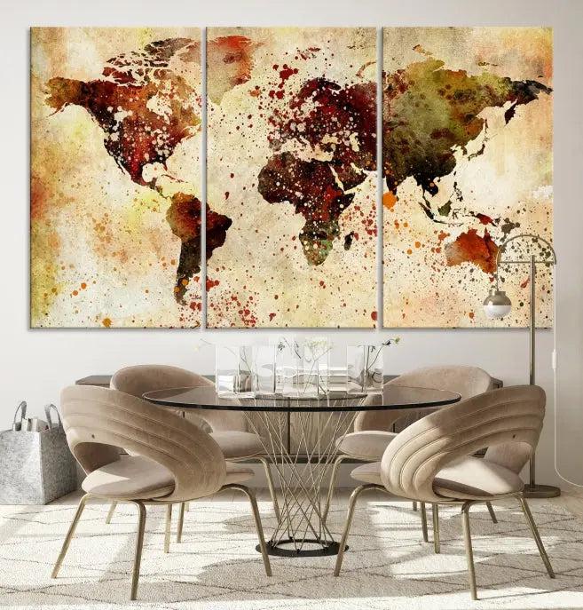 The World Map Wall Art Canvas Print, gallery-wrapped on museum-quality canvas adorned with watercolor splatters, enhances a modern living room decor. This artwork features a UV-protective coating to maintain its vibrant colors and elegant appearance over time.