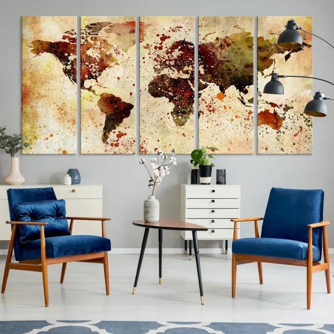 The World Map Wall Art Canvas Print, gallery-wrapped on museum-quality canvas adorned with watercolor splatters, enhances a modern living room decor. This artwork features a UV-protective coating to maintain its vibrant colors and elegant appearance over time.