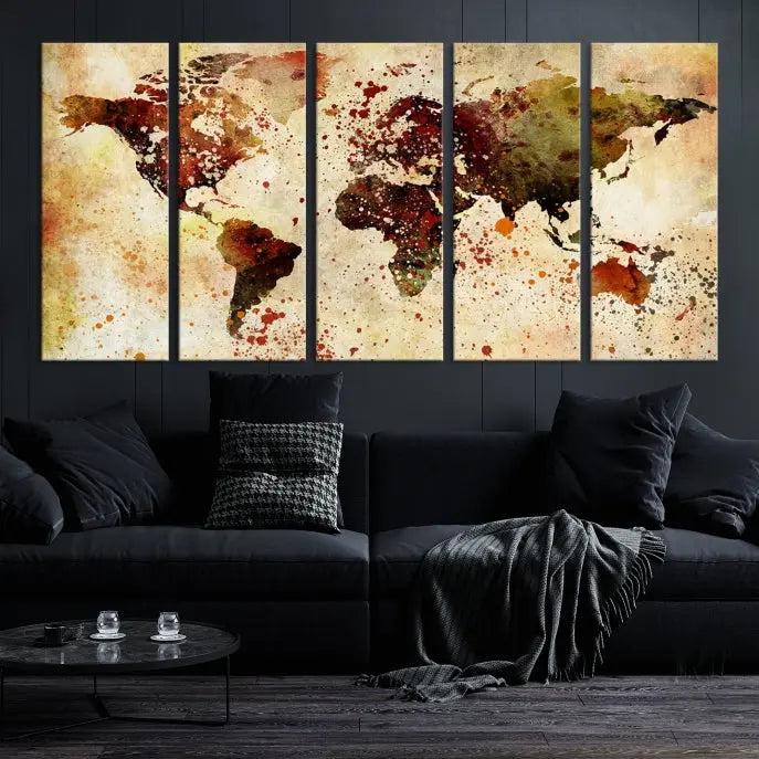 The World Map Wall Art Canvas Print, gallery-wrapped on museum-quality canvas adorned with watercolor splatters, enhances a modern living room decor. This artwork features a UV-protective coating to maintain its vibrant colors and elegant appearance over time.