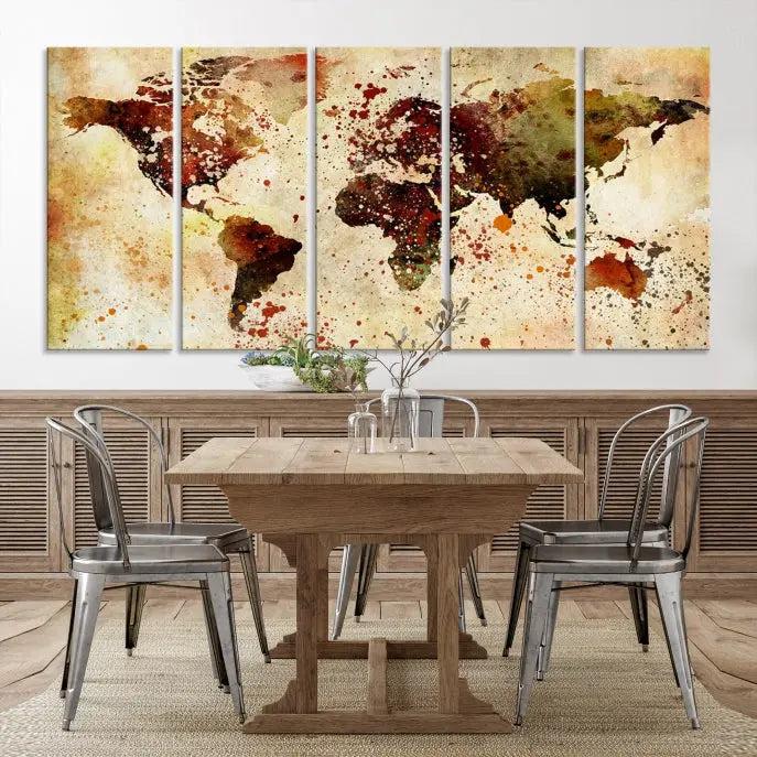 The World Map Wall Art Canvas Print, gallery-wrapped on museum-quality canvas adorned with watercolor splatters, enhances a modern living room decor. This artwork features a UV-protective coating to maintain its vibrant colors and elegant appearance over time.