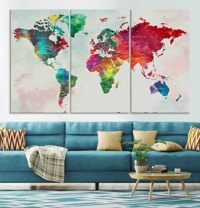 The World Map Wall Art Canvas Print features colorful watercolor continents across three panels, crafted on museum-quality canvas and ready to hang.