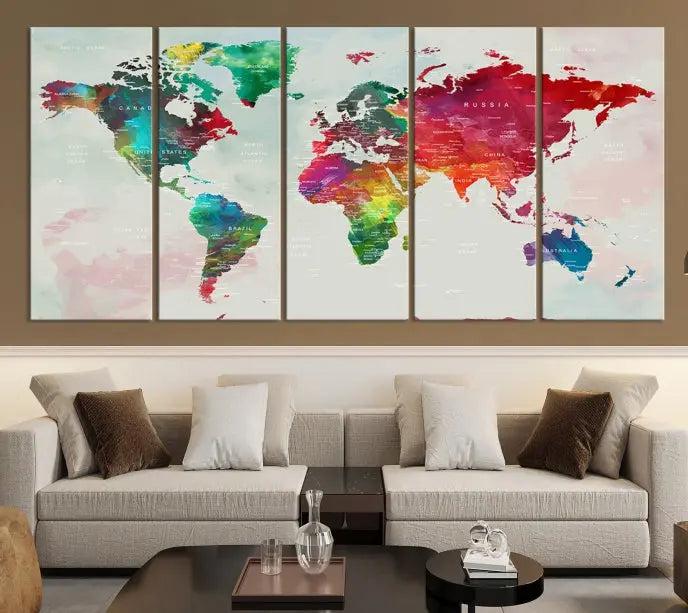 The World Map Wall Art Canvas Print features colorful watercolor continents across three panels, crafted on museum-quality canvas and ready to hang.