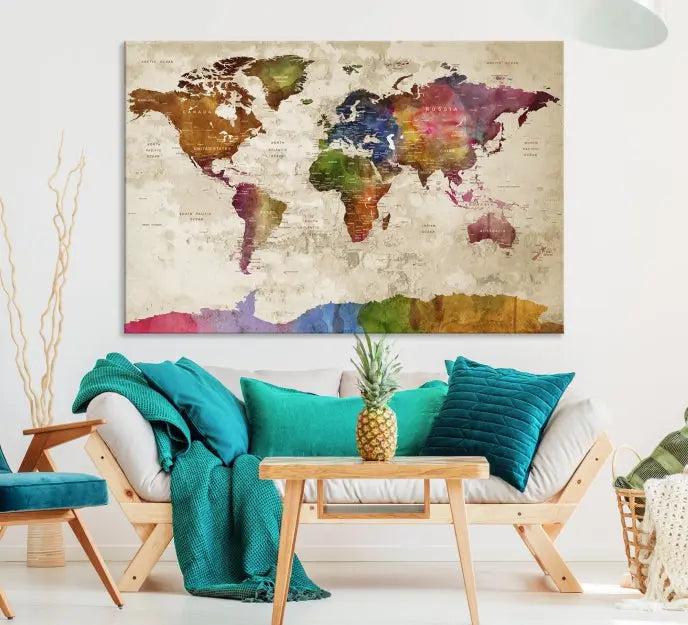 The World Map Wall Art Canvas Print, featuring a vibrant triptych design on museum-quality canvases, decorates the wall. The gallery-wrapped artwork is treated with a UV-protective coating to ensure its colors remain vivid over time.