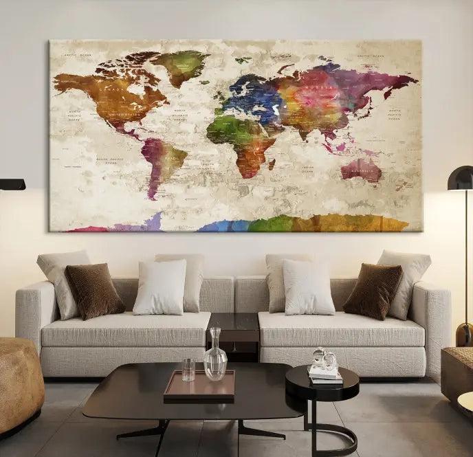 The World Map Wall Art Canvas Print, featuring a vibrant triptych design on museum-quality canvases, decorates the wall. The gallery-wrapped artwork is treated with a UV-protective coating to ensure its colors remain vivid over time.