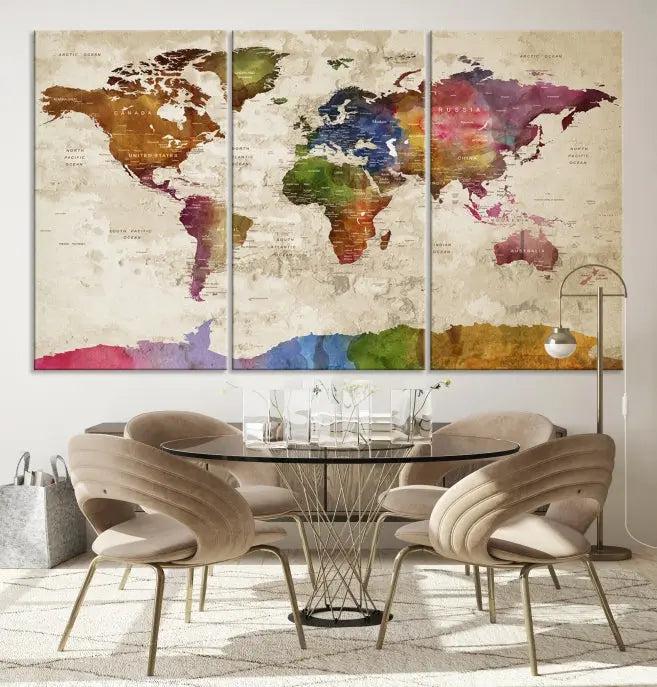 The World Map Wall Art Canvas Print, featuring a vibrant triptych design on museum-quality canvases, decorates the wall. The gallery-wrapped artwork is treated with a UV-protective coating to ensure its colors remain vivid over time.