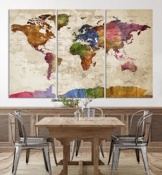 The World Map Wall Art Canvas Print, featuring a vibrant triptych design on museum-quality canvases, decorates the wall. The gallery-wrapped artwork is treated with a UV-protective coating to ensure its colors remain vivid over time.