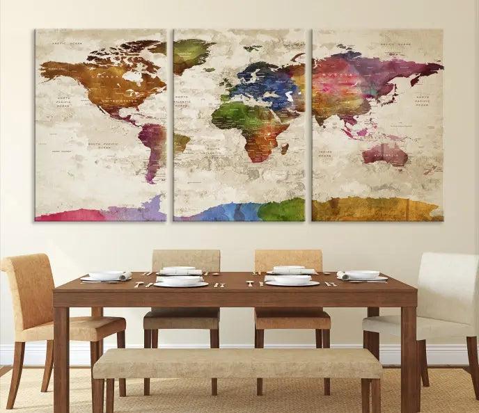 The World Map Wall Art Canvas Print, featuring a vibrant triptych design on museum-quality canvases, decorates the wall. The gallery-wrapped artwork is treated with a UV-protective coating to ensure its colors remain vivid over time.