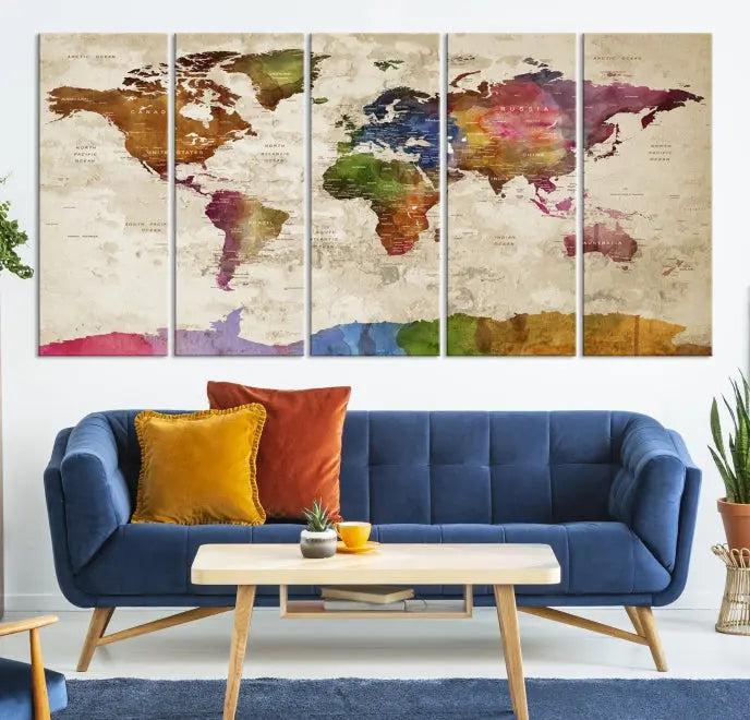 The World Map Wall Art Canvas Print, featuring a vibrant triptych design on museum-quality canvases, decorates the wall. The gallery-wrapped artwork is treated with a UV-protective coating to ensure its colors remain vivid over time.