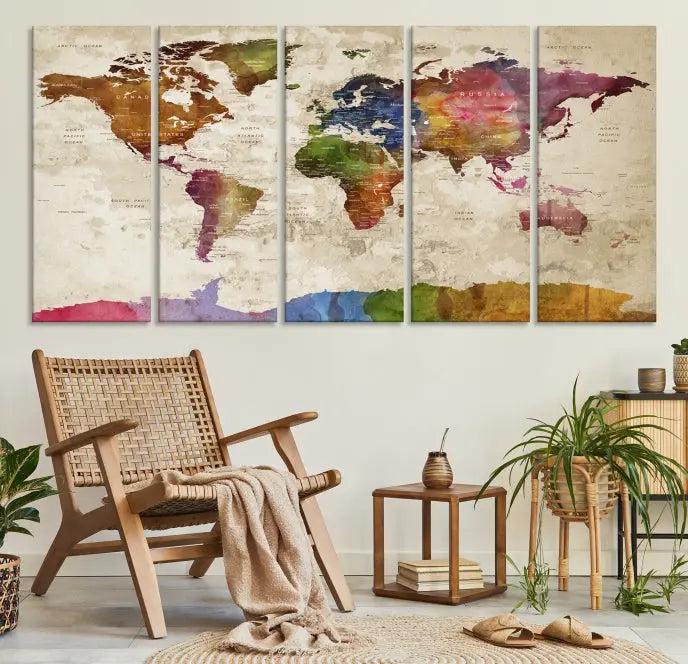 The World Map Wall Art Canvas Print, featuring a vibrant triptych design on museum-quality canvases, decorates the wall. The gallery-wrapped artwork is treated with a UV-protective coating to ensure its colors remain vivid over time.