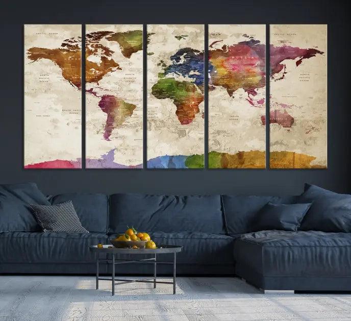 The World Map Wall Art Canvas Print, featuring a vibrant triptych design on museum-quality canvases, decorates the wall. The gallery-wrapped artwork is treated with a UV-protective coating to ensure its colors remain vivid over time.