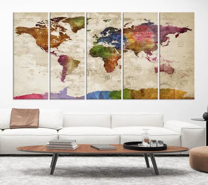 The World Map Wall Art Canvas Print, featuring a vibrant triptych design on museum-quality canvases, decorates the wall. The gallery-wrapped artwork is treated with a UV-protective coating to ensure its colors remain vivid over time.