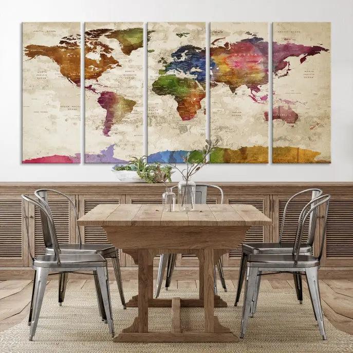 The World Map Wall Art Canvas Print, featuring a vibrant triptych design on museum-quality canvases, decorates the wall. The gallery-wrapped artwork is treated with a UV-protective coating to ensure its colors remain vivid over time.