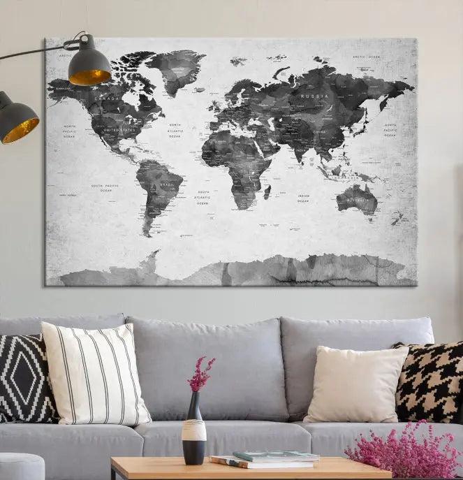 The World Map Wall Art Canvas Print features a three-panel design, printed on museum-quality canvas with a UV-protective coating, and is elegantly displayed on a dark wall.