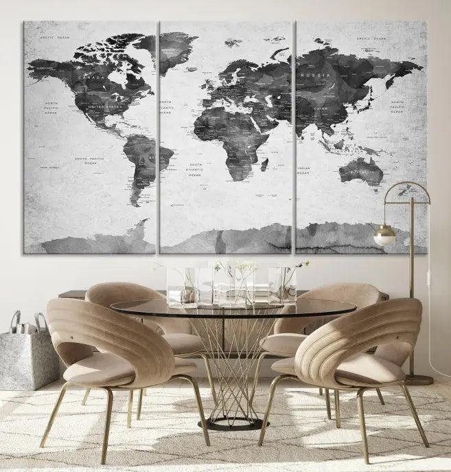 The World Map Wall Art Canvas Print features a three-panel design, printed on museum-quality canvas with a UV-protective coating, and is elegantly displayed on a dark wall.