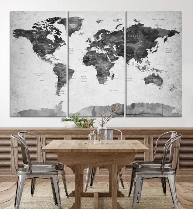 The World Map Wall Art Canvas Print features a three-panel design, printed on museum-quality canvas with a UV-protective coating, and is elegantly displayed on a dark wall.