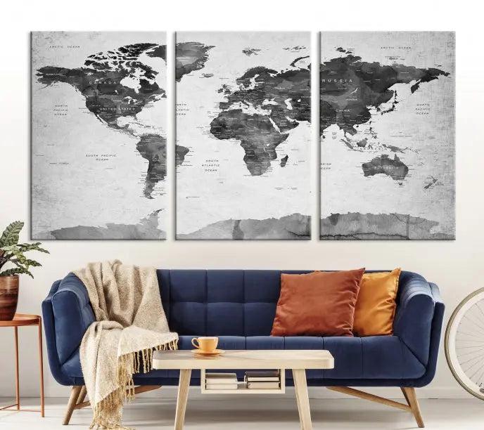 The World Map Wall Art Canvas Print features a three-panel design, printed on museum-quality canvas with a UV-protective coating, and is elegantly displayed on a dark wall.