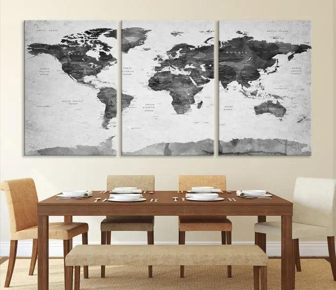 The World Map Wall Art Canvas Print features a three-panel design, printed on museum-quality canvas with a UV-protective coating, and is elegantly displayed on a dark wall.