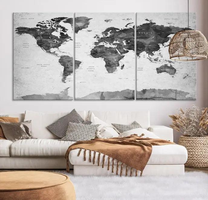 The World Map Wall Art Canvas Print features a three-panel design, printed on museum-quality canvas with a UV-protective coating, and is elegantly displayed on a dark wall.