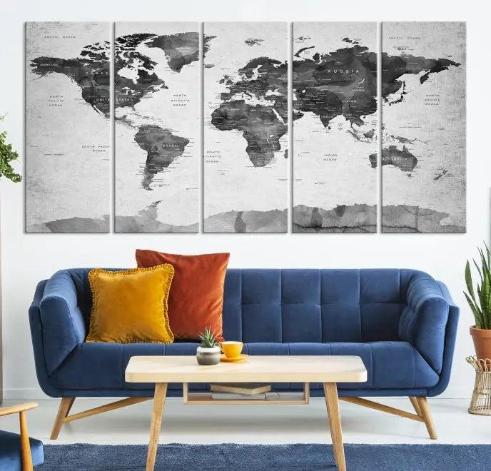 The World Map Wall Art Canvas Print features a three-panel design, printed on museum-quality canvas with a UV-protective coating, and is elegantly displayed on a dark wall.