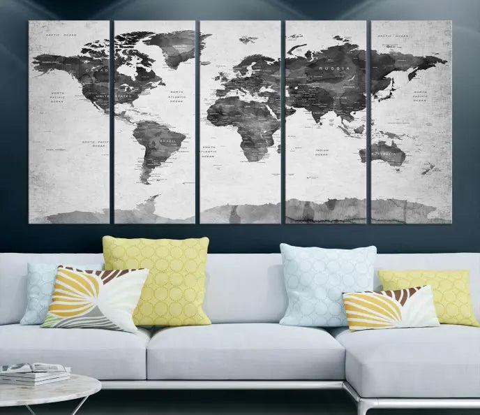 The World Map Wall Art Canvas Print features a three-panel design, printed on museum-quality canvas with a UV-protective coating, and is elegantly displayed on a dark wall.