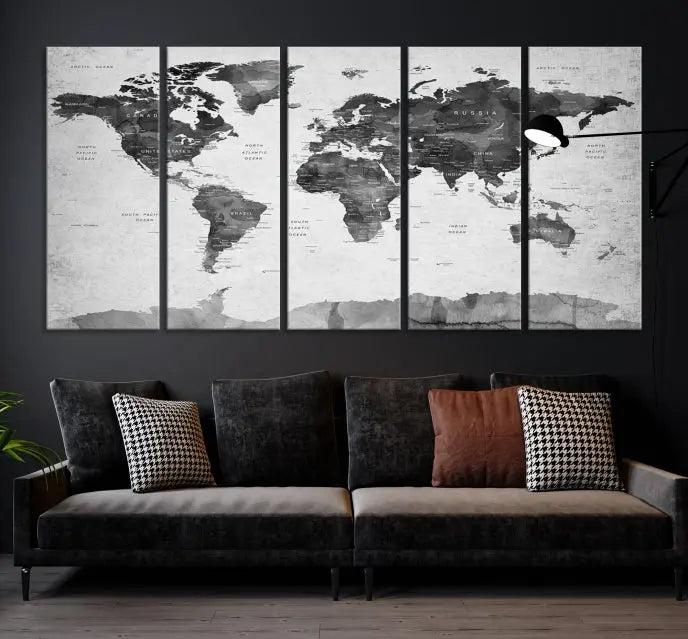 The World Map Wall Art Canvas Print features a three-panel design, printed on museum-quality canvas with a UV-protective coating, and is elegantly displayed on a dark wall.