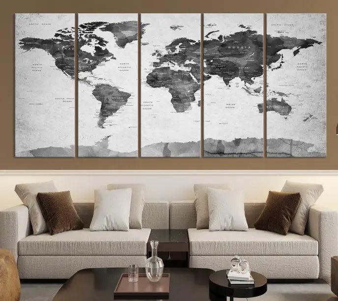 The World Map Wall Art Canvas Print features a three-panel design, printed on museum-quality canvas with a UV-protective coating, and is elegantly displayed on a dark wall.