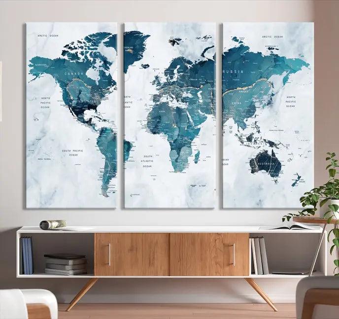 A World Map Wall Art Canvas Print, consisting of three panels and crafted on museum-quality canvas with a UV-protective coating, is showcased in the stylish living room.