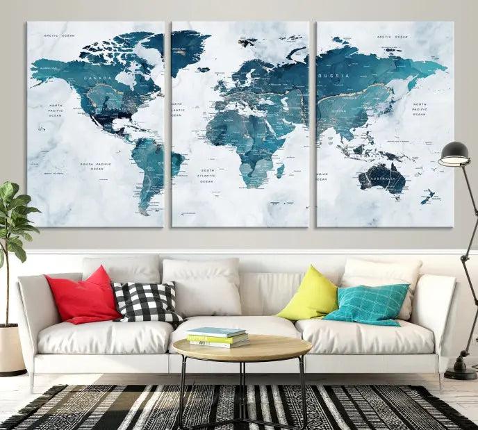 A World Map Wall Art Canvas Print, consisting of three panels and crafted on museum-quality canvas with a UV-protective coating, is showcased in the stylish living room.