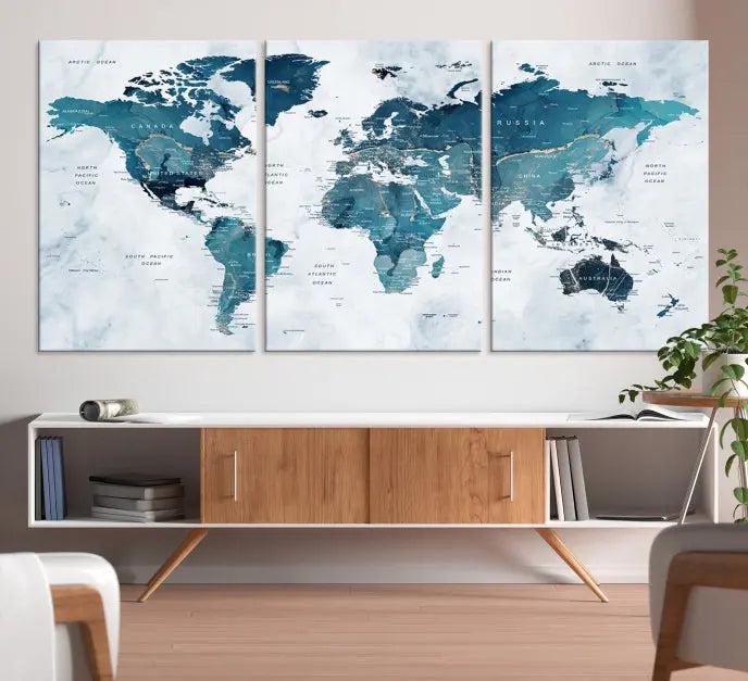 A World Map Wall Art Canvas Print, consisting of three panels and crafted on museum-quality canvas with a UV-protective coating, is showcased in the stylish living room.