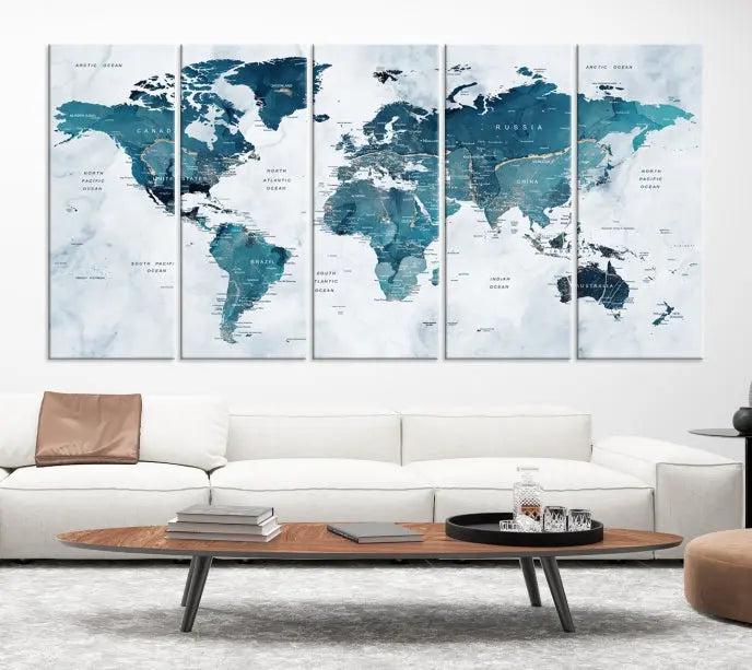 A World Map Wall Art Canvas Print, consisting of three panels and crafted on museum-quality canvas with a UV-protective coating, is showcased in the stylish living room.