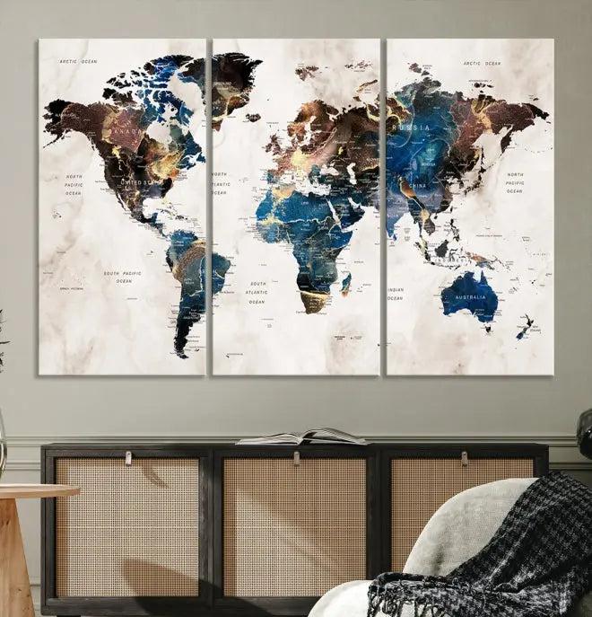 A striking three-panel World Map Wall Art Canvas Print, crafted by a skilled artisan, adorns the wall in this modern living room. This piece, printed on museum-quality canvas with a UV-protective coating, combines elegance and longevity.