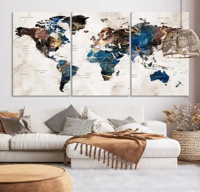 A striking three-panel World Map Wall Art Canvas Print, crafted by a skilled artisan, adorns the wall in this modern living room. This piece, printed on museum-quality canvas with a UV-protective coating, combines elegance and longevity.