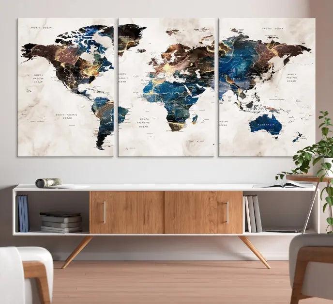 A striking three-panel World Map Wall Art Canvas Print, crafted by a skilled artisan, adorns the wall in this modern living room. This piece, printed on museum-quality canvas with a UV-protective coating, combines elegance and longevity.