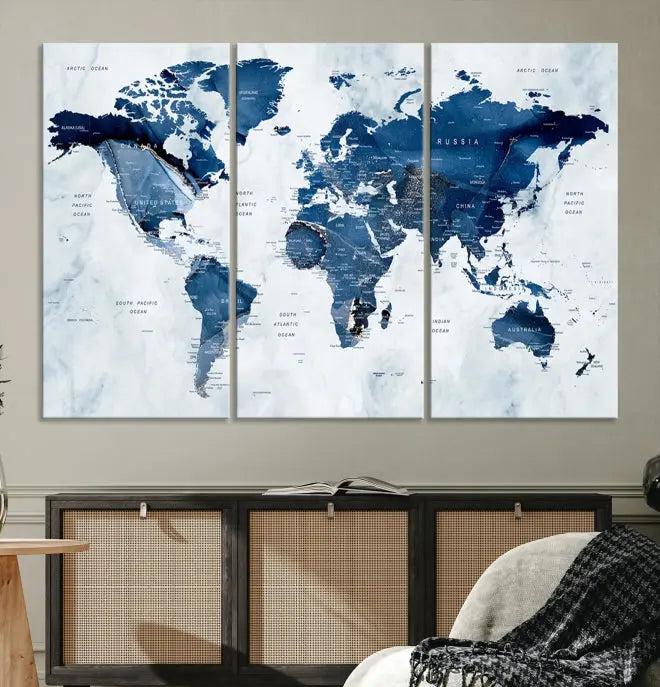 World Map Wall Art Canvas Print featuring blue continents on a textured backdrop, crafted with museum-quality polycotton and gallery-wrapped.