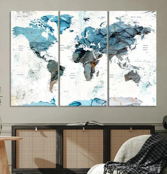 The World Map Wall Art Canvas Print, featuring a three-panel design with blue tones on museum-quality canvas, brings elegance to the room. This gallery-wrapped piece enhances the space with its sophisticated aesthetic.