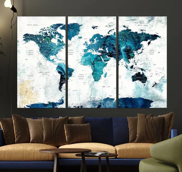 The World Map Wall Art Canvas Print features a gallery-wrapped triptych in blue and green hues. These museum-quality canvases are equipped with a UV-protective coating to keep the artwork vibrant and enduring.