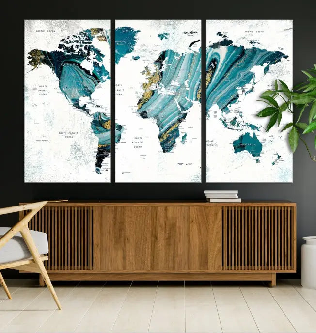 The modern living room features the World Map Wall Art Canvas Print, a three-panel abstract design on museum-quality canvases. The artwork includes a UV-protective coating and is ready to hang.