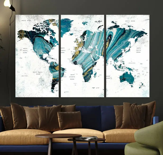 The modern living room features the World Map Wall Art Canvas Print, a three-panel abstract design on museum-quality canvases. The artwork includes a UV-protective coating and is ready to hang.