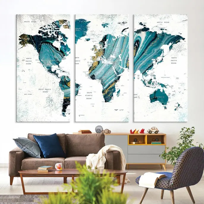 The modern living room features the World Map Wall Art Canvas Print, a three-panel abstract design on museum-quality canvases. The artwork includes a UV-protective coating and is ready to hang.