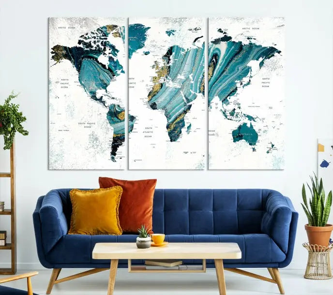 The modern living room features the World Map Wall Art Canvas Print, a three-panel abstract design on museum-quality canvases. The artwork includes a UV-protective coating and is ready to hang.