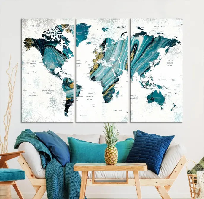 The modern living room features the World Map Wall Art Canvas Print, a three-panel abstract design on museum-quality canvases. The artwork includes a UV-protective coating and is ready to hang.