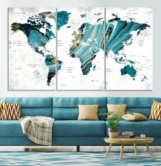 The modern living room features the World Map Wall Art Canvas Print, a three-panel abstract design on museum-quality canvases. The artwork includes a UV-protective coating and is ready to hang.