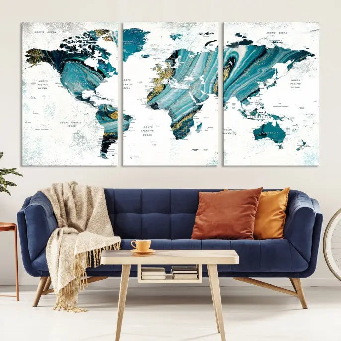 The modern living room features the World Map Wall Art Canvas Print, a three-panel abstract design on museum-quality canvases. The artwork includes a UV-protective coating and is ready to hang.