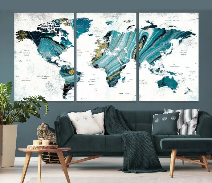 The modern living room features the World Map Wall Art Canvas Print, a three-panel abstract design on museum-quality canvases. The artwork includes a UV-protective coating and is ready to hang.