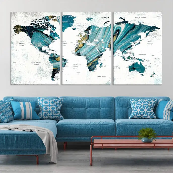 The modern living room features the World Map Wall Art Canvas Print, a three-panel abstract design on museum-quality canvases. The artwork includes a UV-protective coating and is ready to hang.