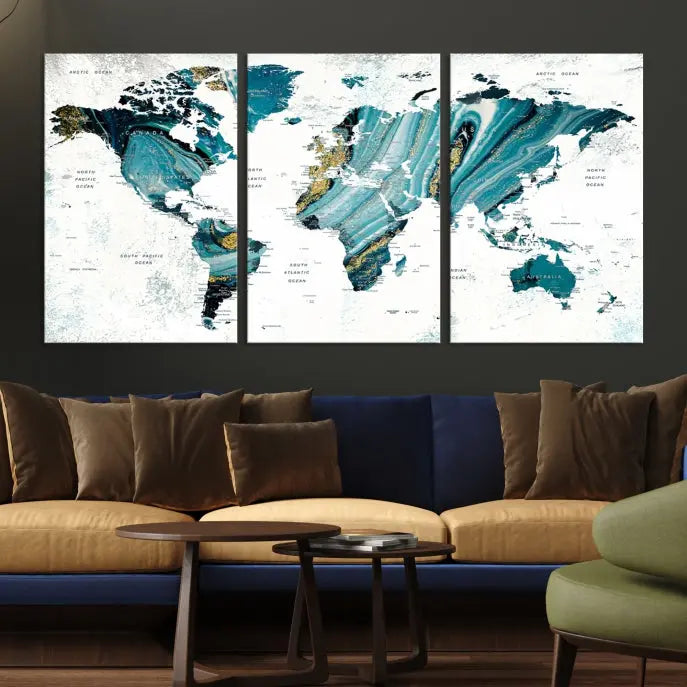 The modern living room features the World Map Wall Art Canvas Print, a three-panel abstract design on museum-quality canvases. The artwork includes a UV-protective coating and is ready to hang.